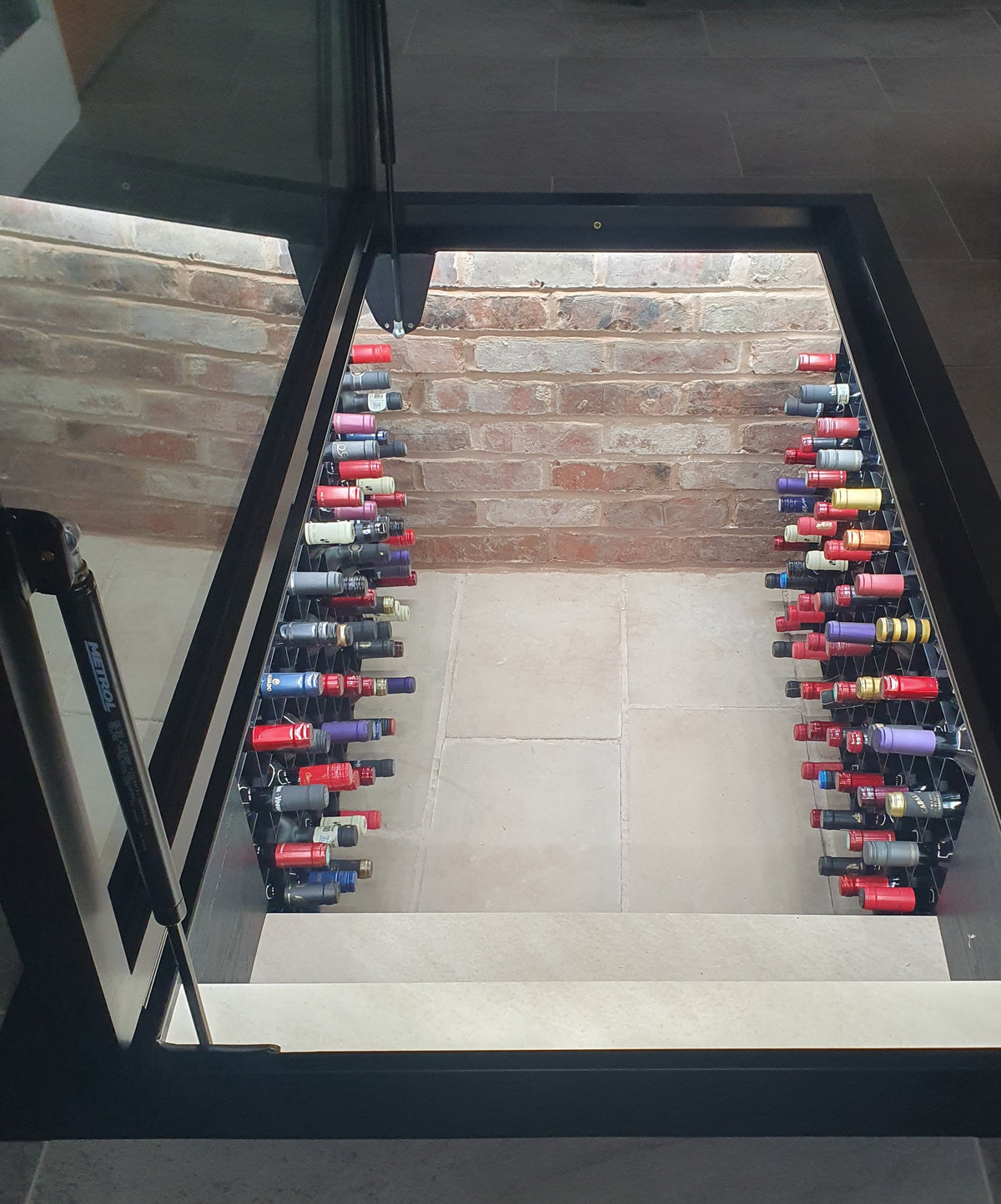 Walk on glass wine cellar hatch in a polished floor