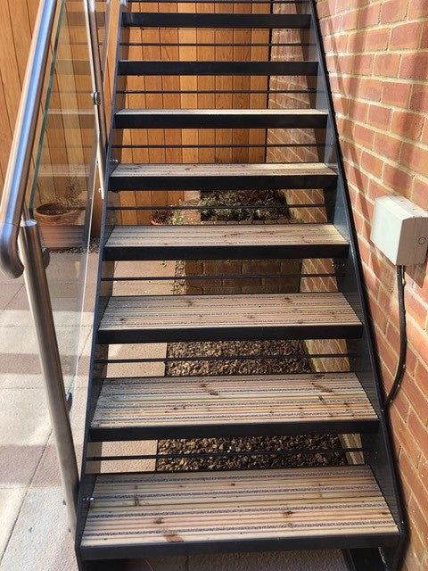 Pan treads with composite decking infill on a powder coated steel staircase