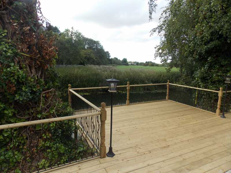 Metal deck panel installed between deck posts