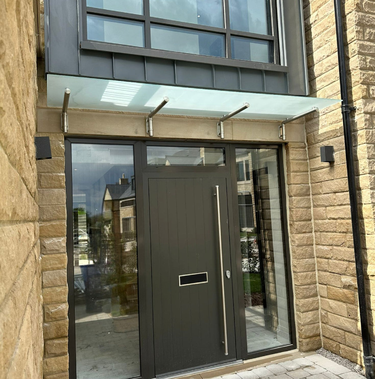 Modern stainless steel and glass door canopies