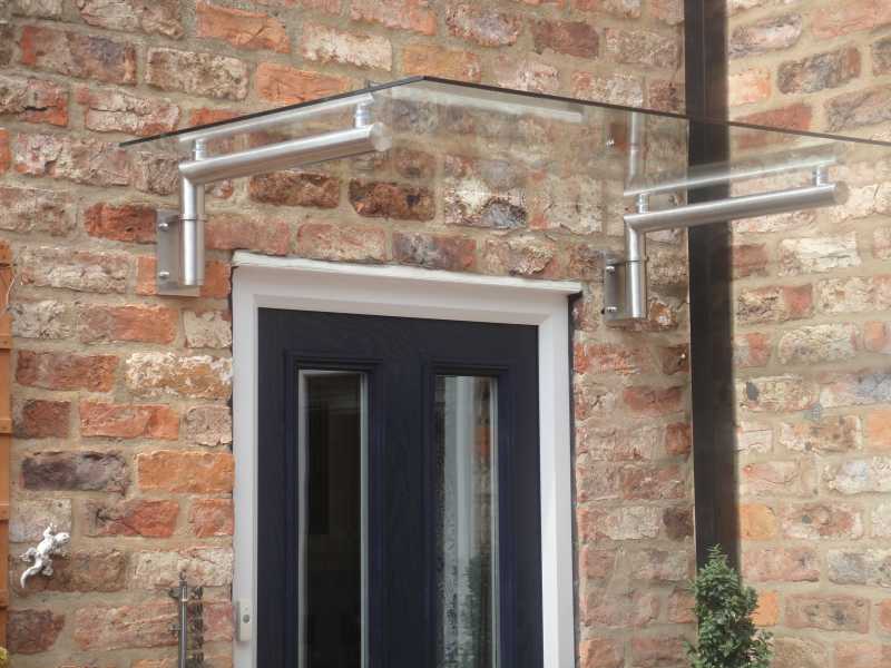 Modern glass door canopy T1 with stainless steel brackets