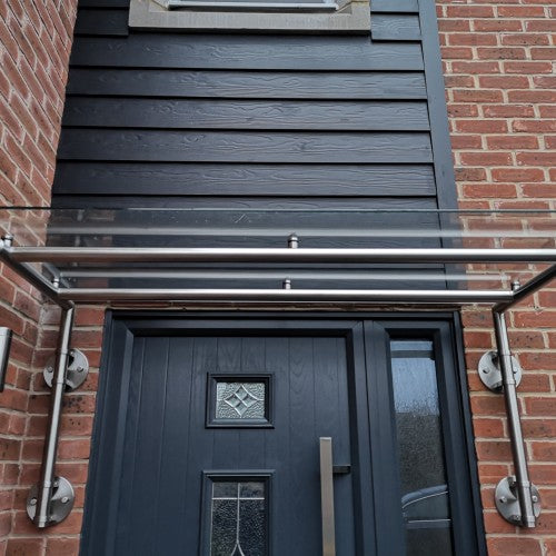 Wide span glass canopy on stainless steel brackets