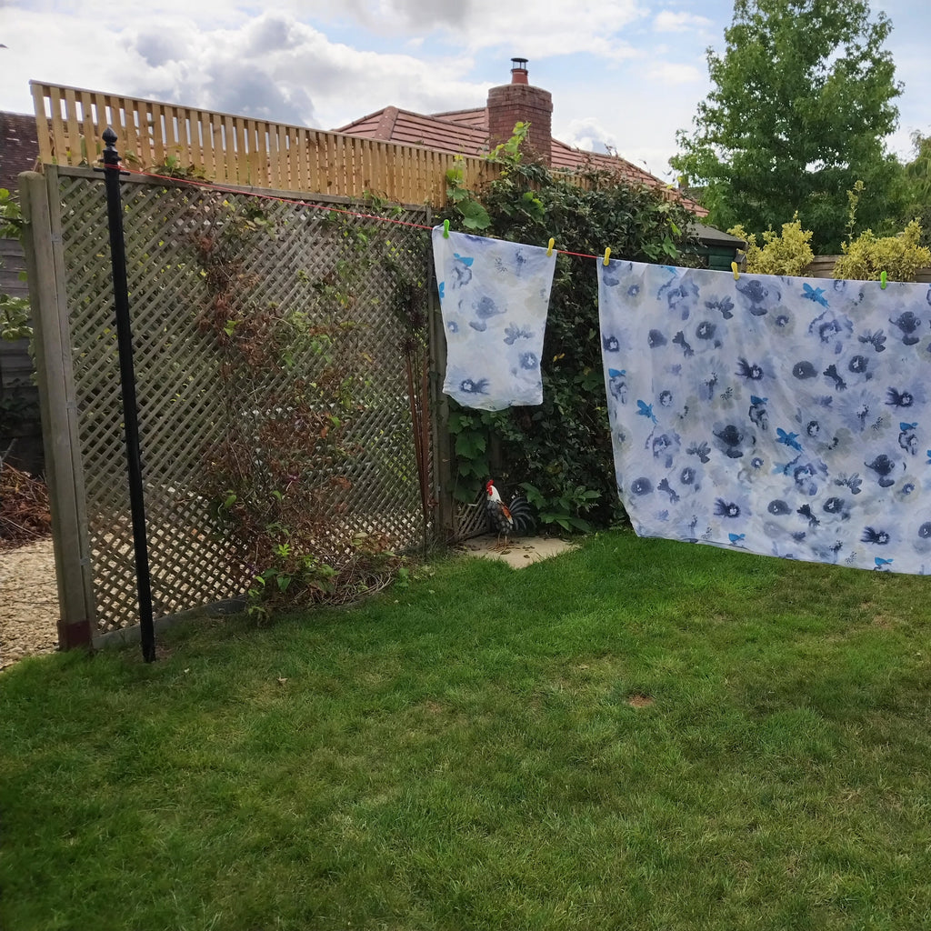Ornate washing line pole in use with washing hung on the line