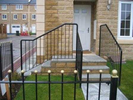Painted ball top railings on a dwarf wall