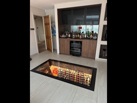 Electric rectangular glass wine cellar door opening on twin synchronised actuators