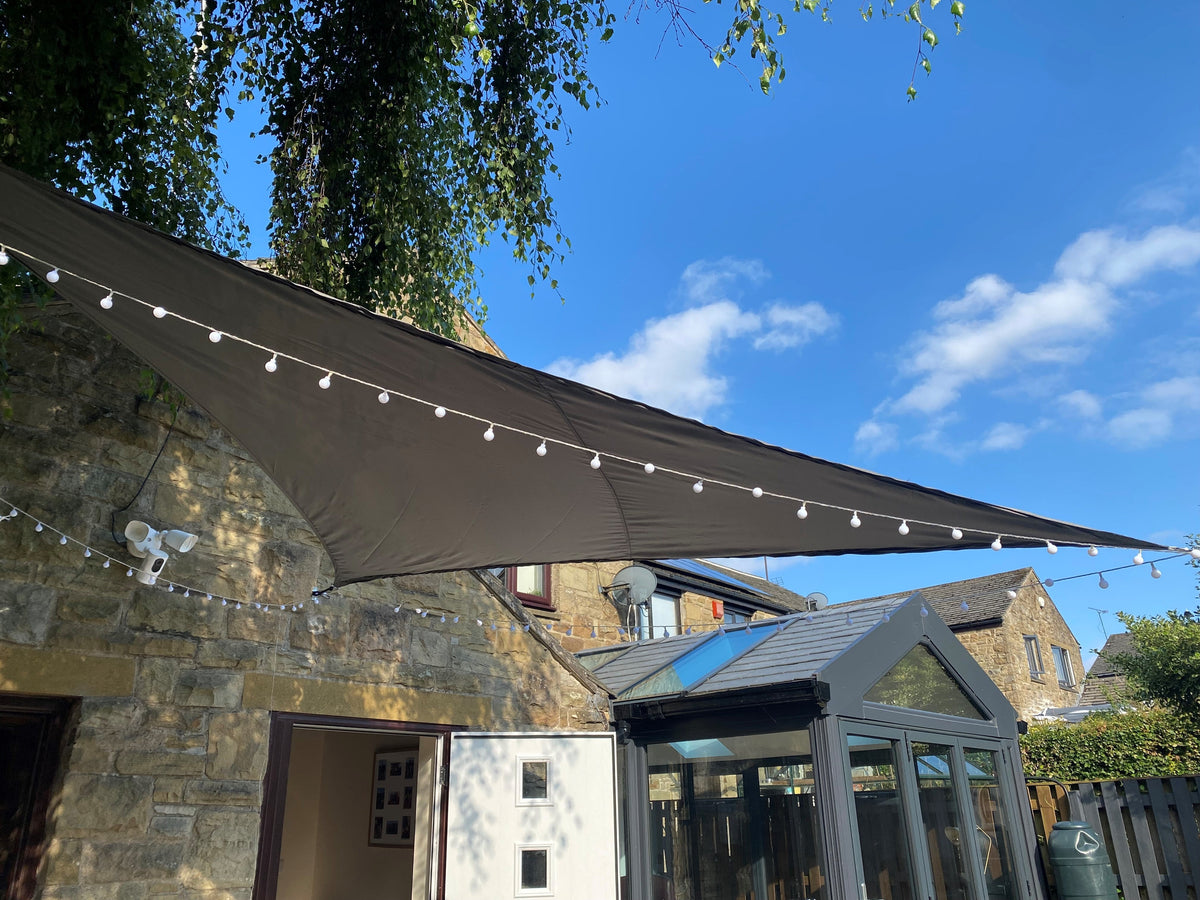 Grey shade sail tensioned from a galvanised steel shade sail post