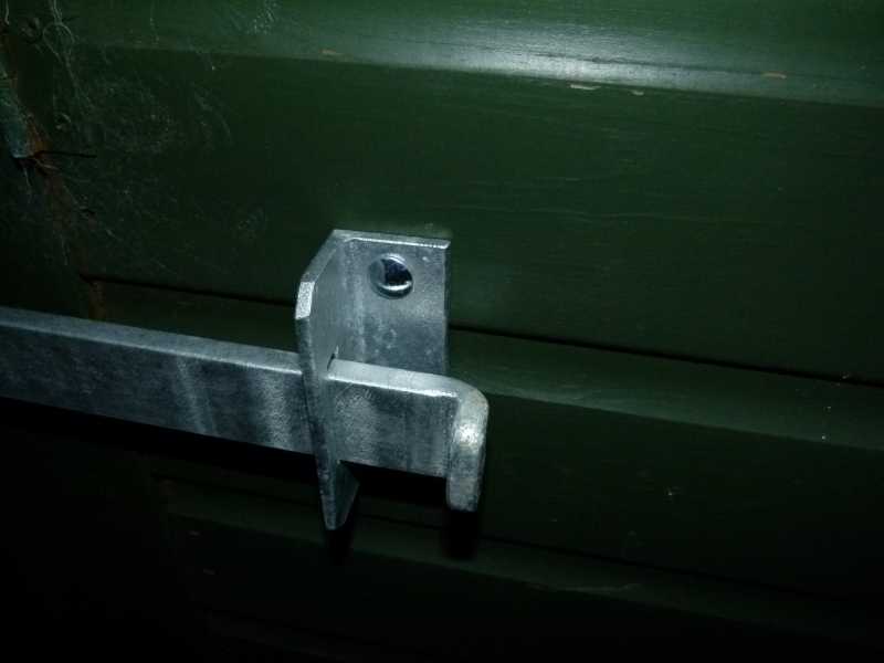 Solid steel shed security bar and coach bolt fixings