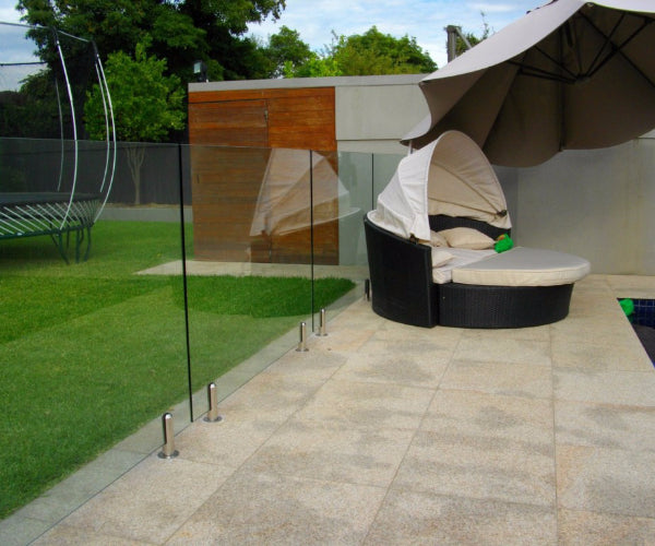 Stainless steel spigot clamps holding a toughened glass panel