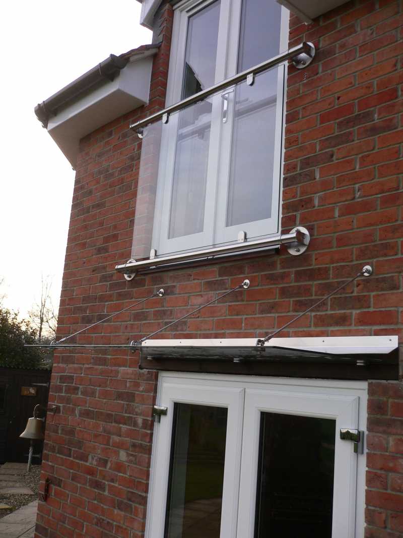 Stainless steel and glass Juliet balcony installed to French doors