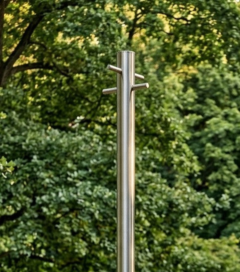Stainless steel washing line pole with tie-bars, shown against mature trees
