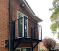 Step-out balcony with metal balustrade on shaped steel brackets, no posts to the ground