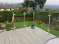 System 2 stainless steel balustrade posts holding toughened glass with no handrail