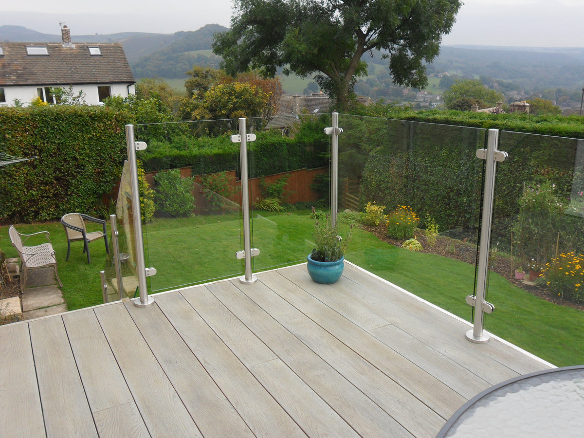 System 2 stainless steel balustrade posts holding toughened glass with no handrail