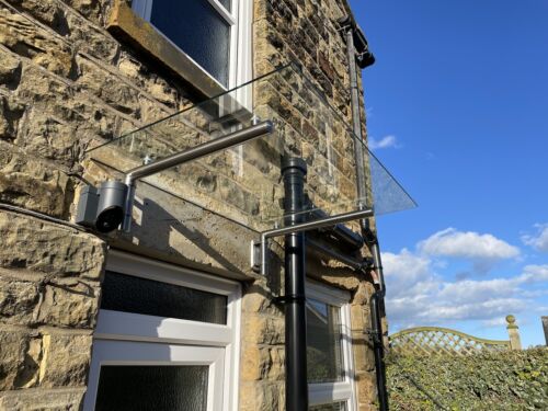 T1 glass door canopy with brushed stainless steel brackets