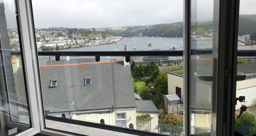Glass fixing detail on a wide spanning Juliet balcony