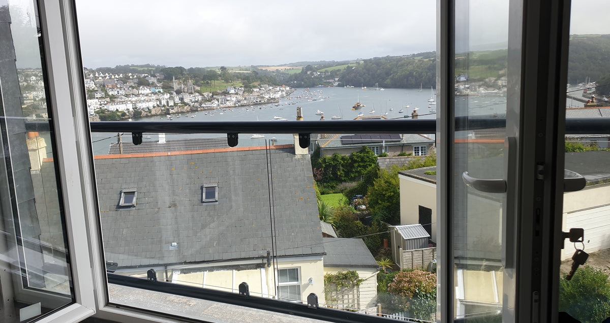 Glass fixing detail on a wide spanning Juliet balcony