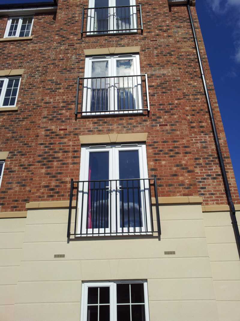 York galvanised steel Juliet balcony with square bars and ball-topped posts, installed